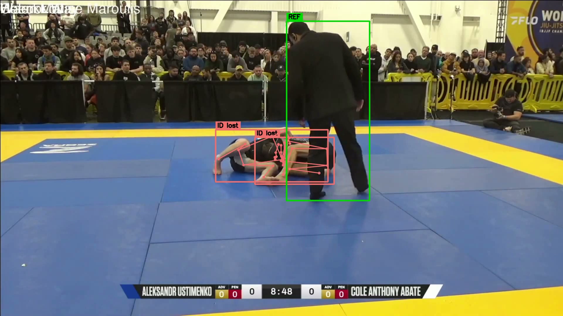 Referee overlapping athlete during check